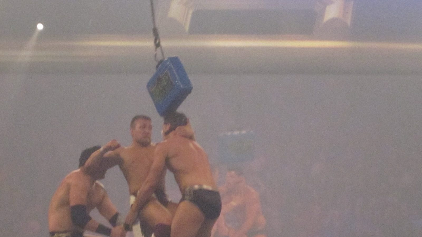 Daniel Bryan, Wade Barrett and Cody Rhodes fight at the top of a ladder beneath the briefcase at Money in the Bank 2011 in Rosemont, Illinois
