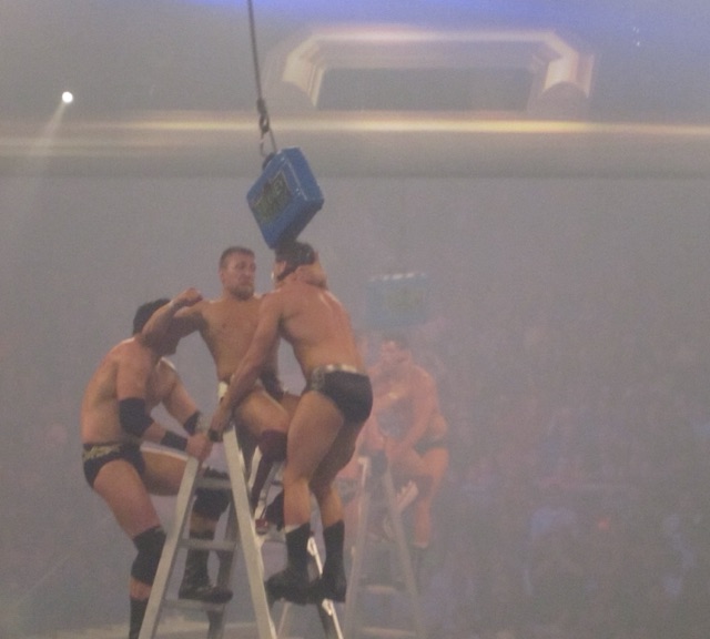 Daniel Bryan, Wade Barrett and Cody Rhodes fight at the top of a ladder beneath the briefcase at Money in the Bank 2011 in Rosemont, Illinois