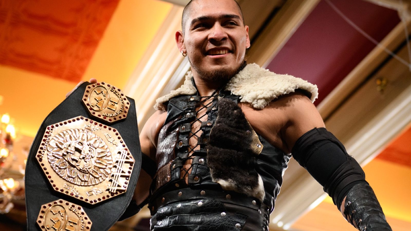 El Hijo del Vikingo in a fur-trimmed ring vest holding a championship belt at a Game Changer Wrestling show in January 2023