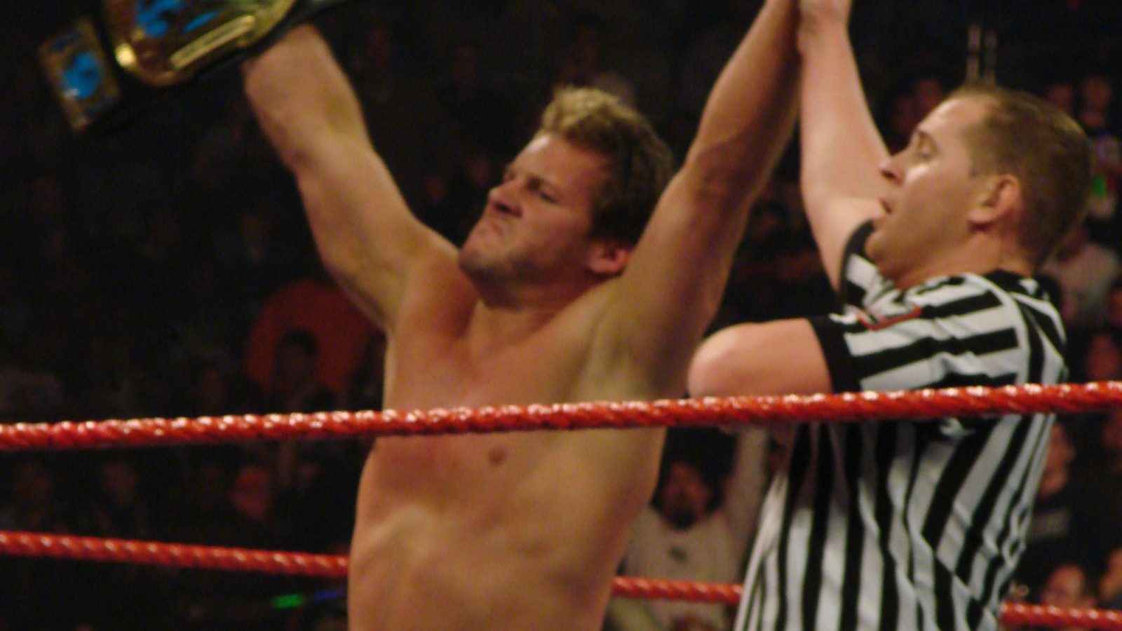 Chris Jericho raises the Intercontinental Championship belt as the referee lifts his arm after winning the title on Raw in Milwaukee on March 10, 2008