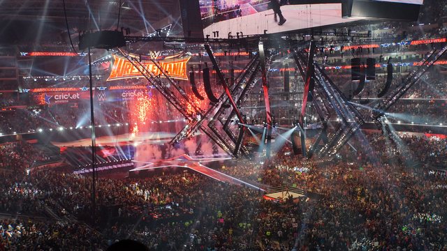 Pyrotechnics over the WrestleMania 32 entrance stage and ring inside a packed AT&T Stadium in Arlington, Texas on April 3, 2016
